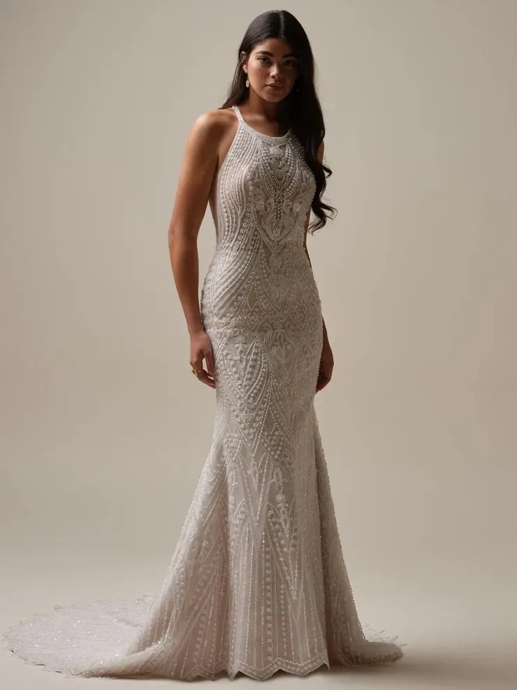 A woman is wearing a white wedding dress with a train.