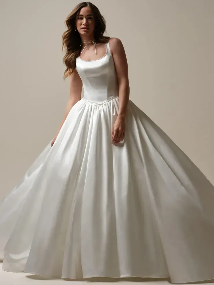 A woman is wearing a white satin wedding dress.
