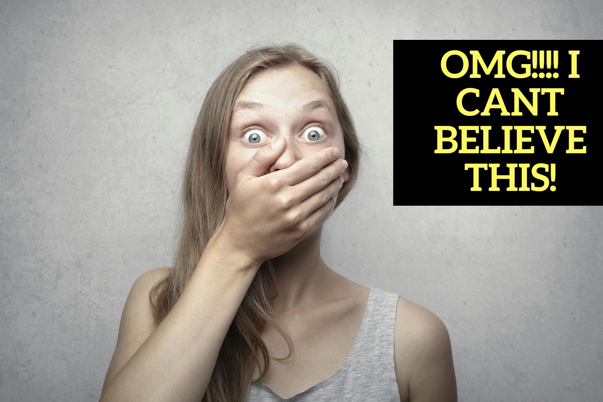 A woman covering her mouth with her hand in front of a sign that says omg cant believe this