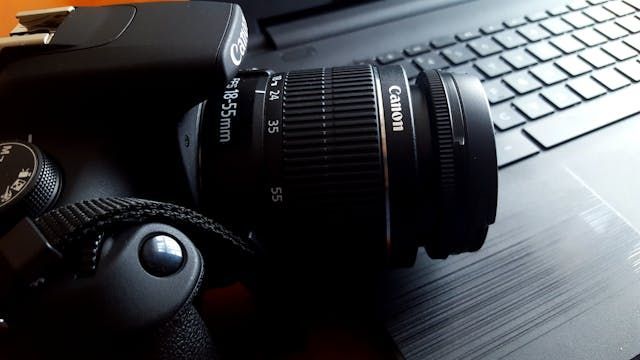 canon+camera+sitting+on+a+computer