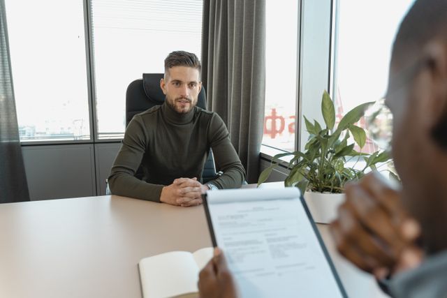 landlord+interviewing+a+potential+tenant