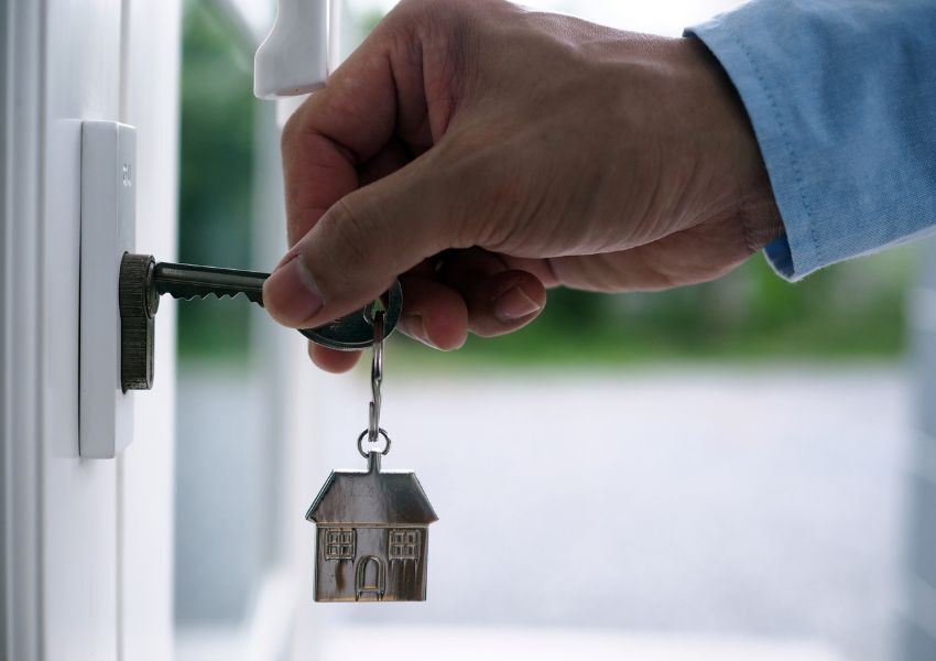 person-turning-key-in-lock