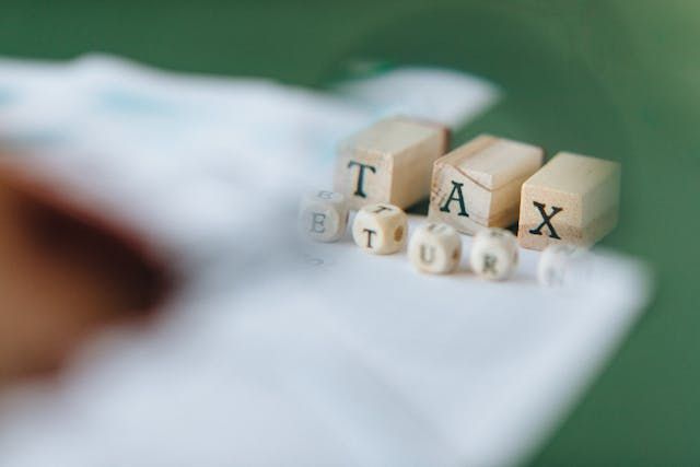 word+TAX+spelled+out+in+wooden+blocks
