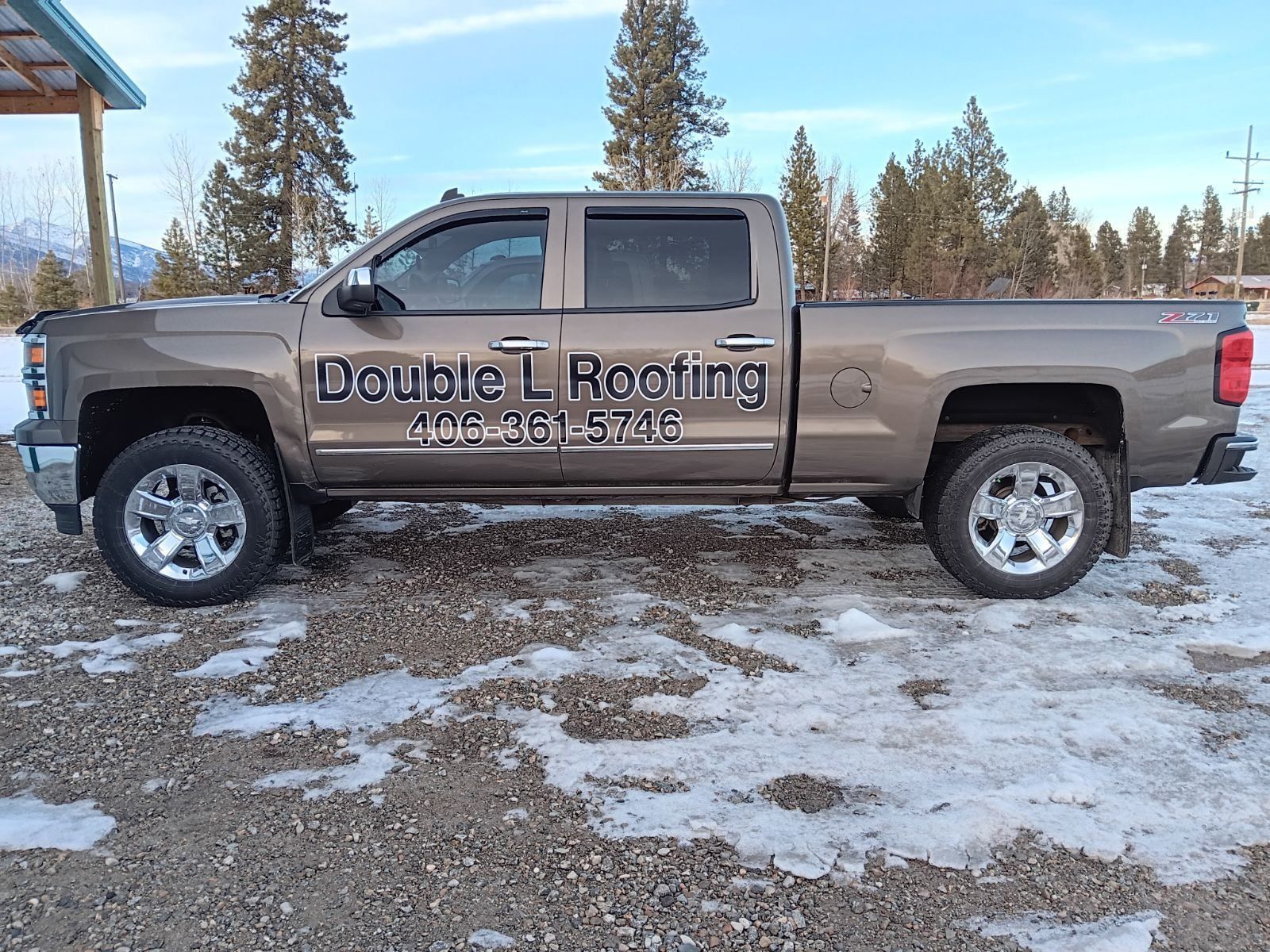 A brown double-cab pickup truck with 