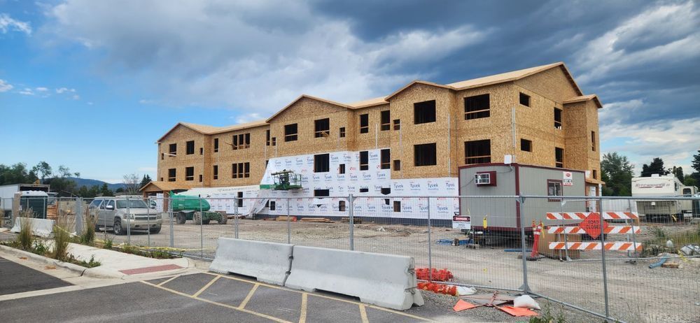 Large Building with Metal Fence | Victor, MT | Double L Roofing 