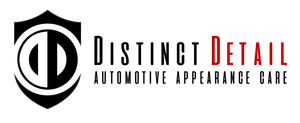 A black and white logo for distinct detail automotive appearance care