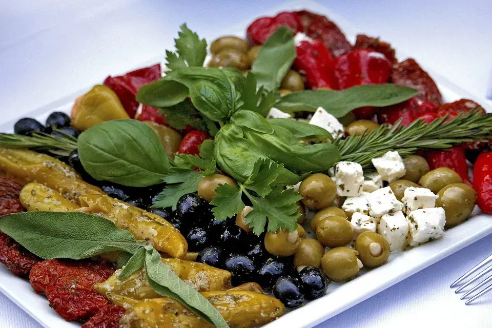 A white plate topped with a variety of vegetables