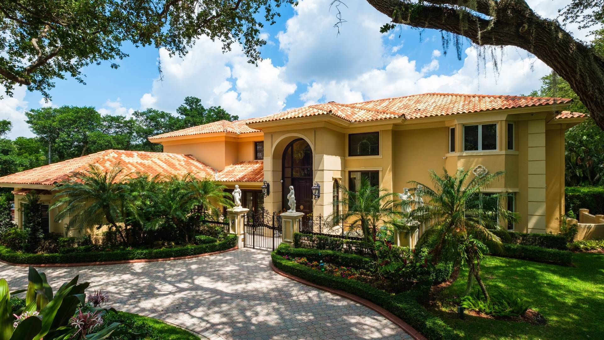 A large house with a driveway leading to it
