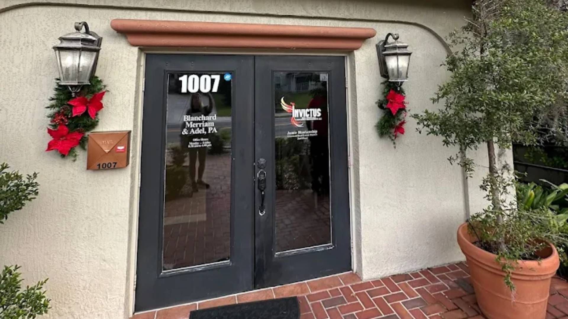 The front door of a building with the number 1007 on it