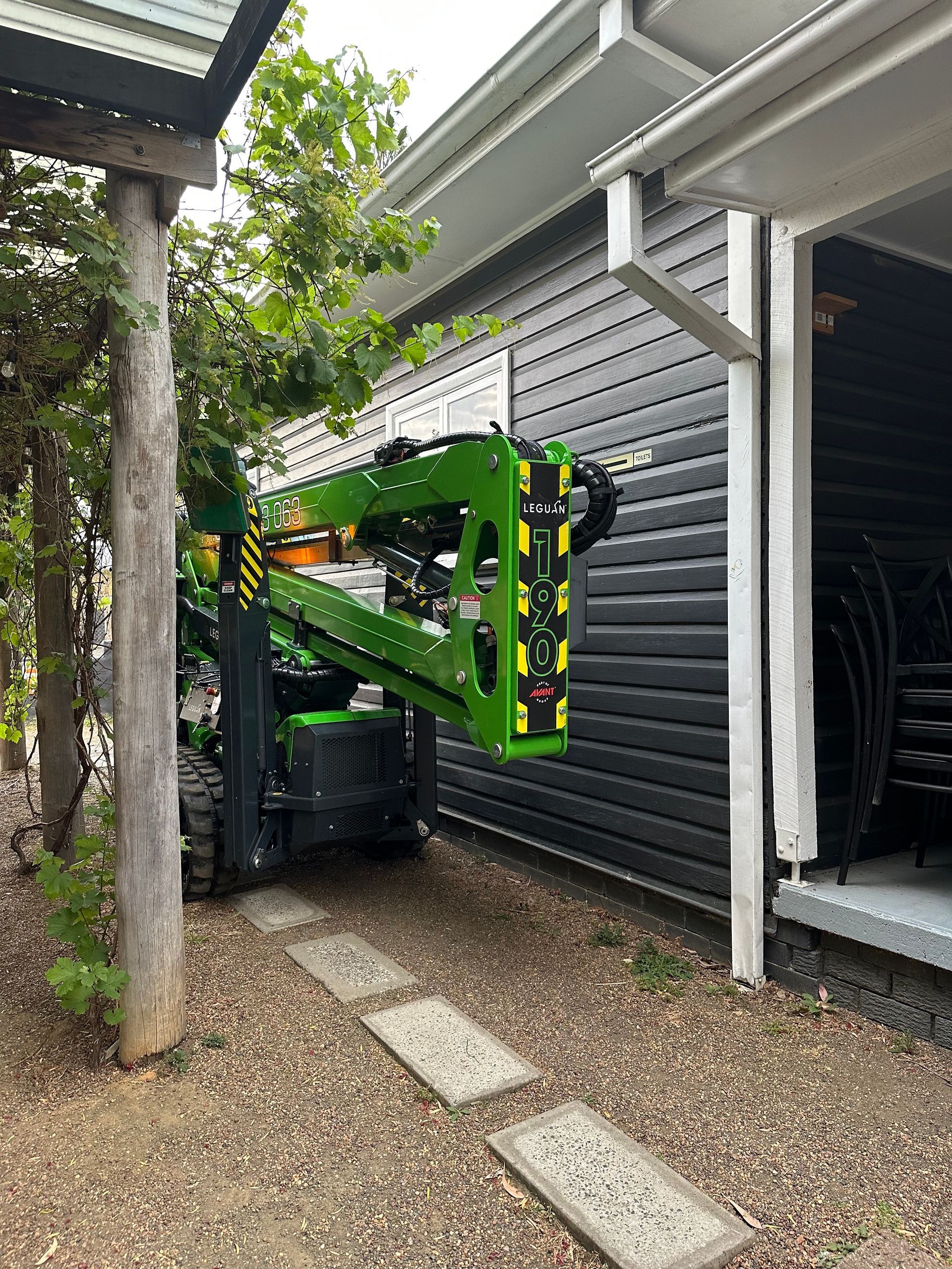 A Spiderlift Next To A House — High Work Services in Maitland, NSW