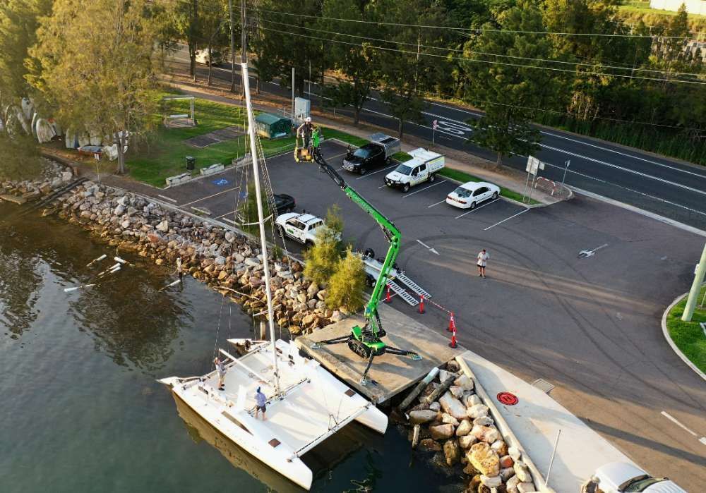 An Aerial View Of A Boat Docked Next To A Body Of Water — High Work Services in Maitland, NSW