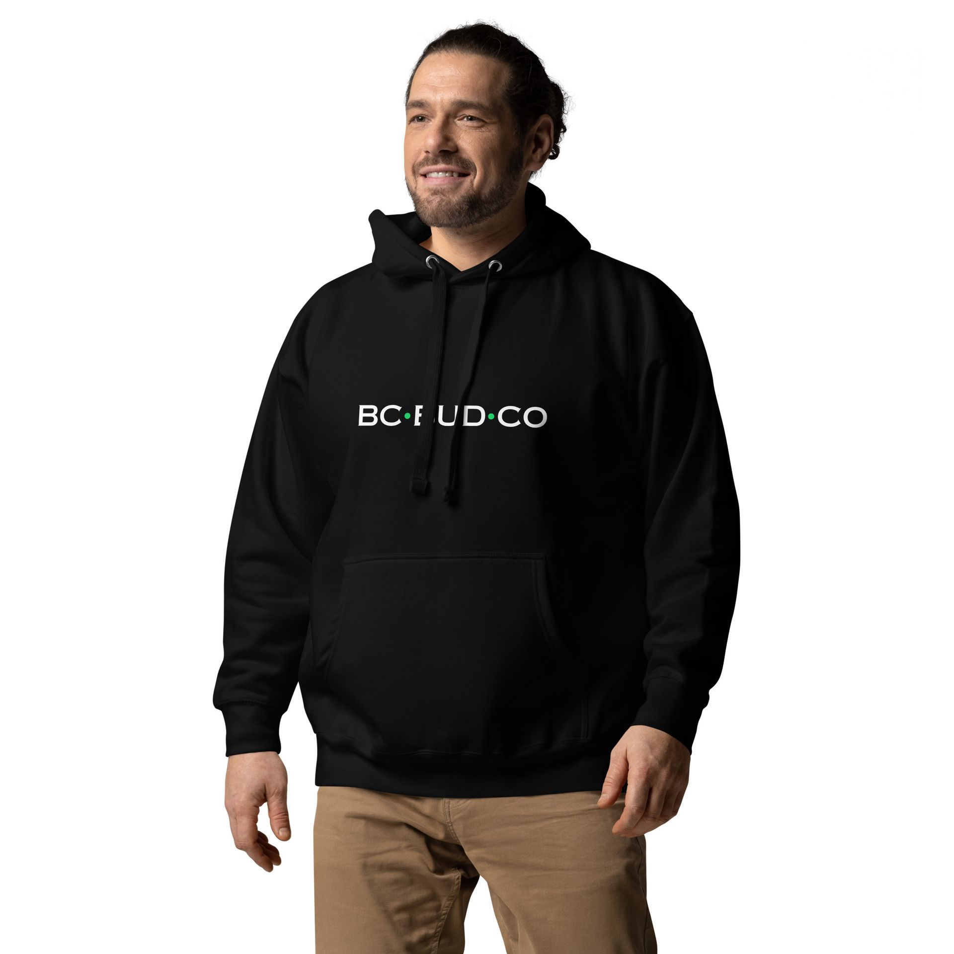 A man is wearing a black hoodie with the word bc on it.