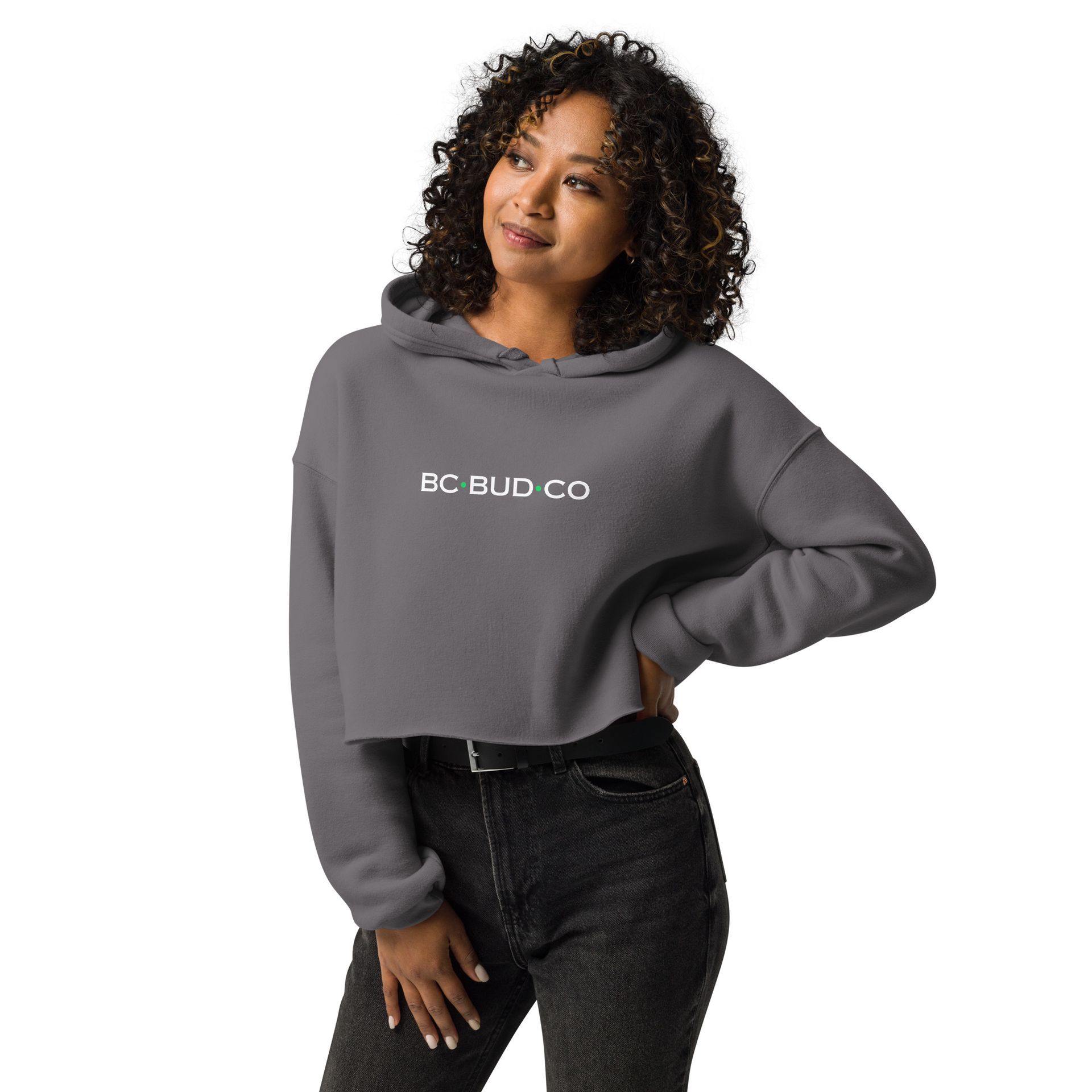 A woman is wearing a gray crop top hoodie.