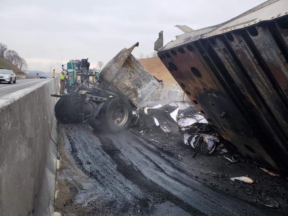 A truck that has turned over on the side of the road