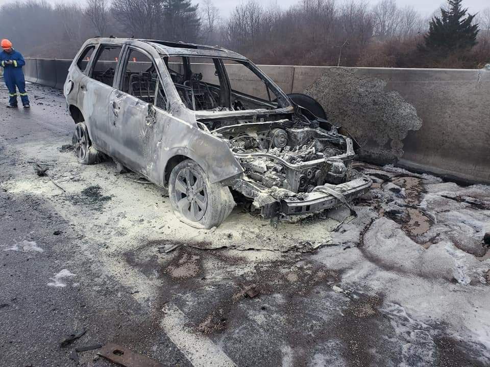 A car that has been burned down.