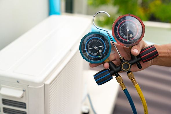 Technician Checking Air Conditioner — Haughton, LA — Trust Air Heating & Cooling