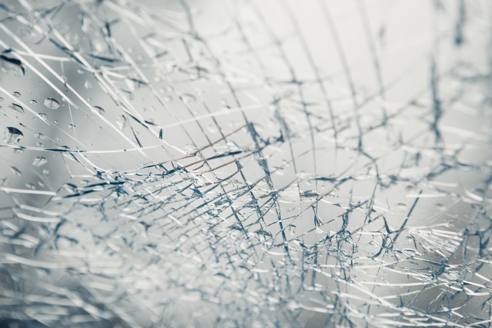 A Close Up of a Broken Glass Window — Southside Glass & Aluminium In Bentley Park, QLD 