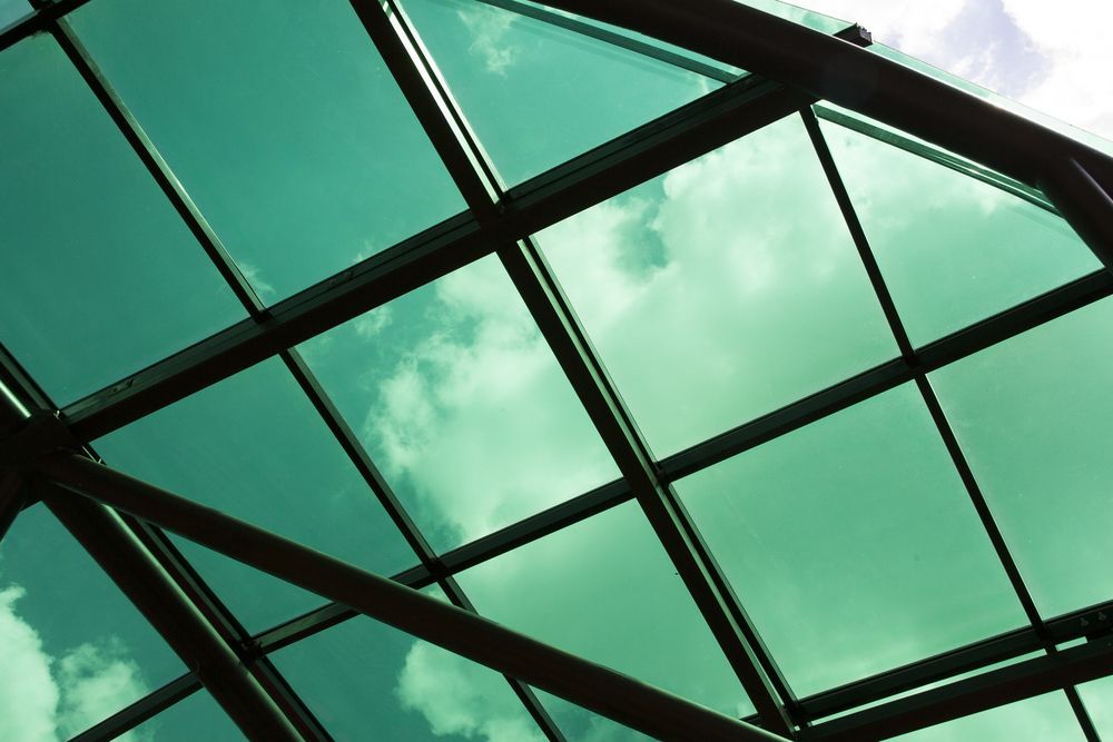 Looking Up at the Sky Through a Green Glass Roof — Southside Glass & Aluminium In Bentley Park, QLD
