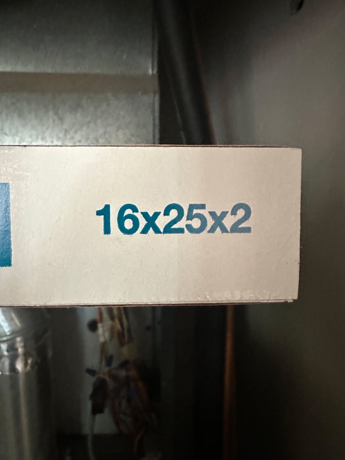 Furnace filter with blue text “16x25x2”.