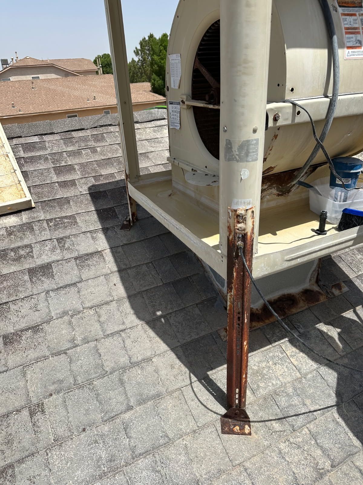 Rusting swamp cooler on the roof of an Albuquerque home, ready to be replaced with refrigerated air