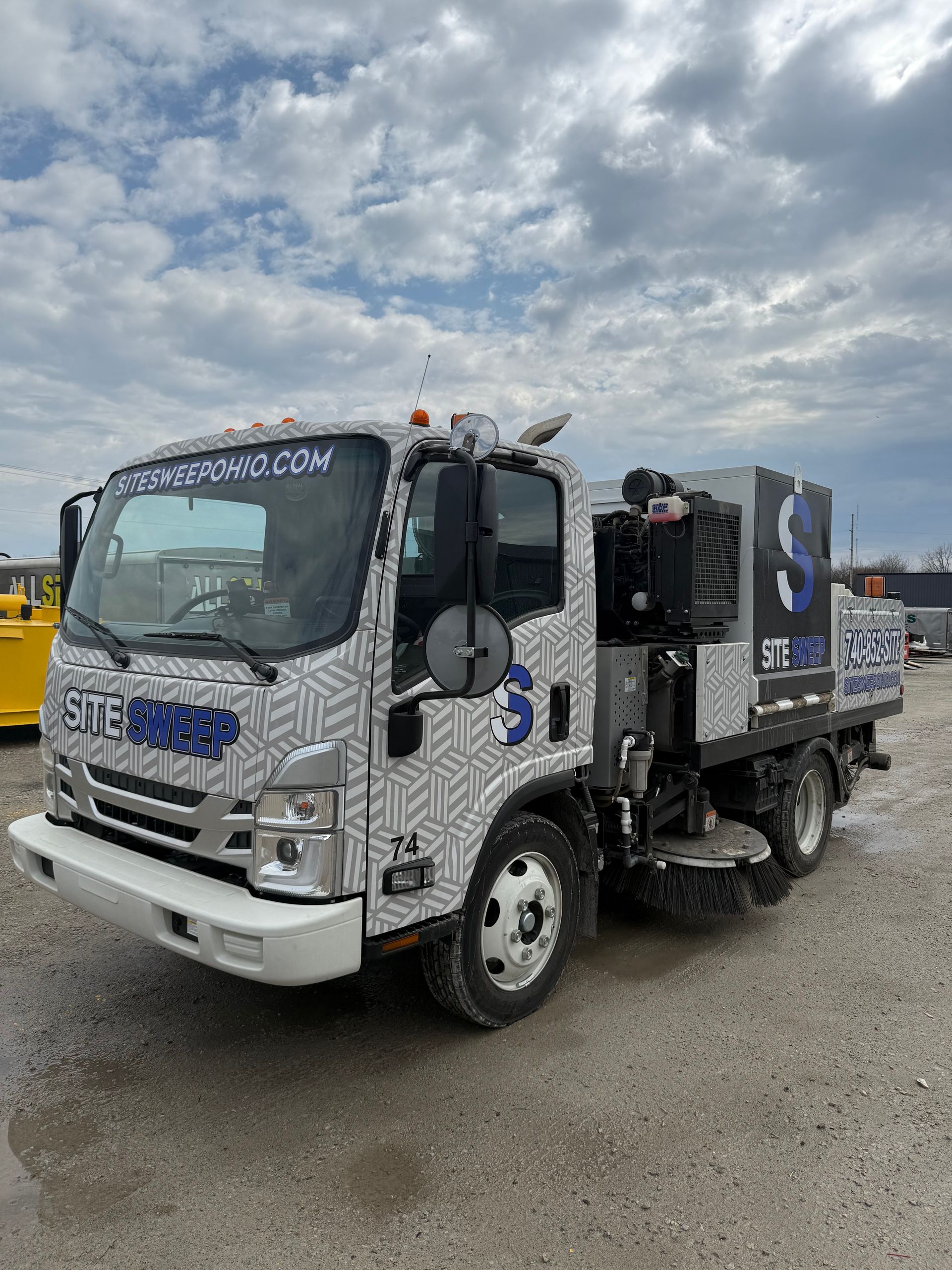 Image of site sweep truck sweeping a construction site