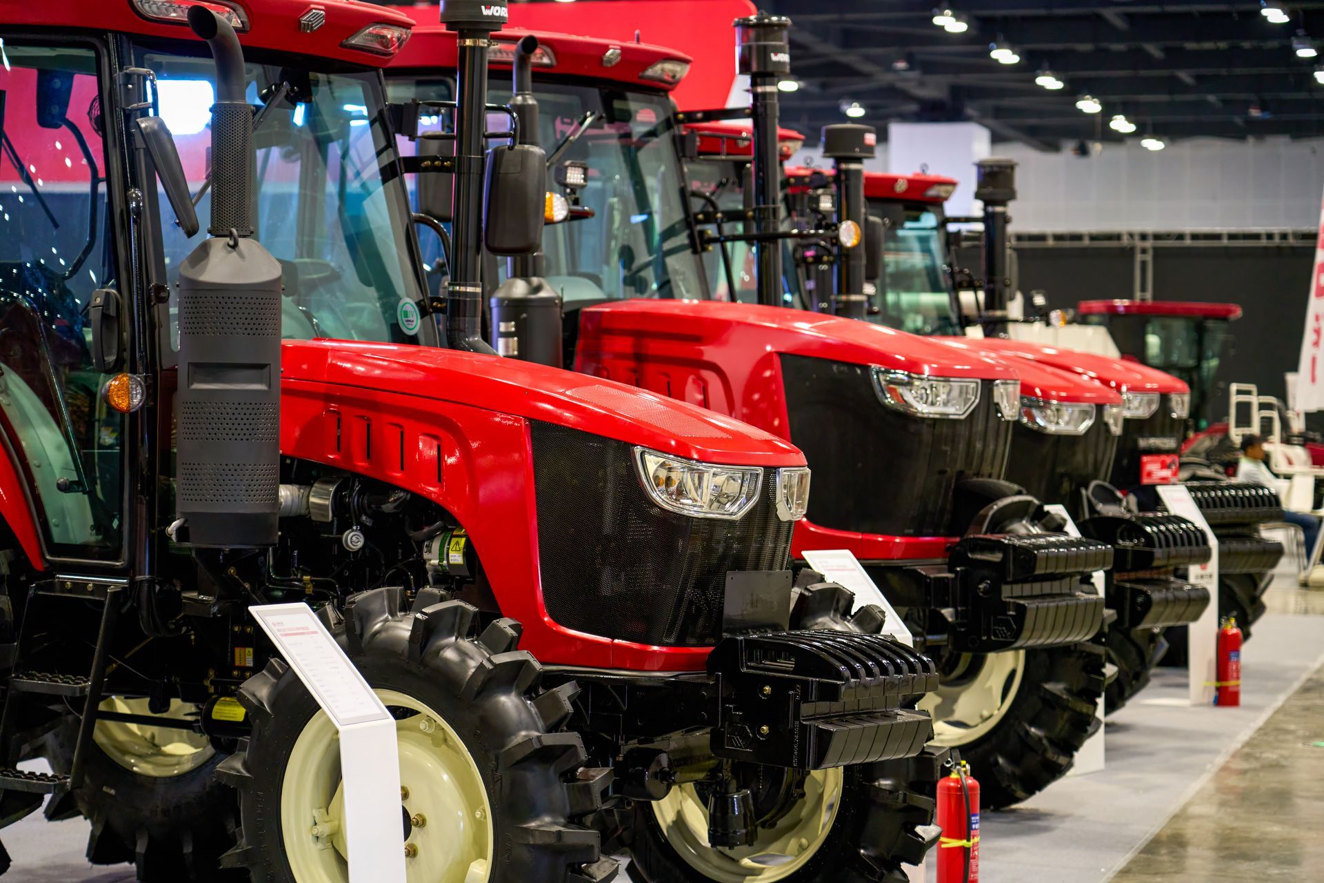 Partial close-up of brand-new agricultural machinery of the colour red. Partial close-up of brand-new agricultural machinery of the colour red.