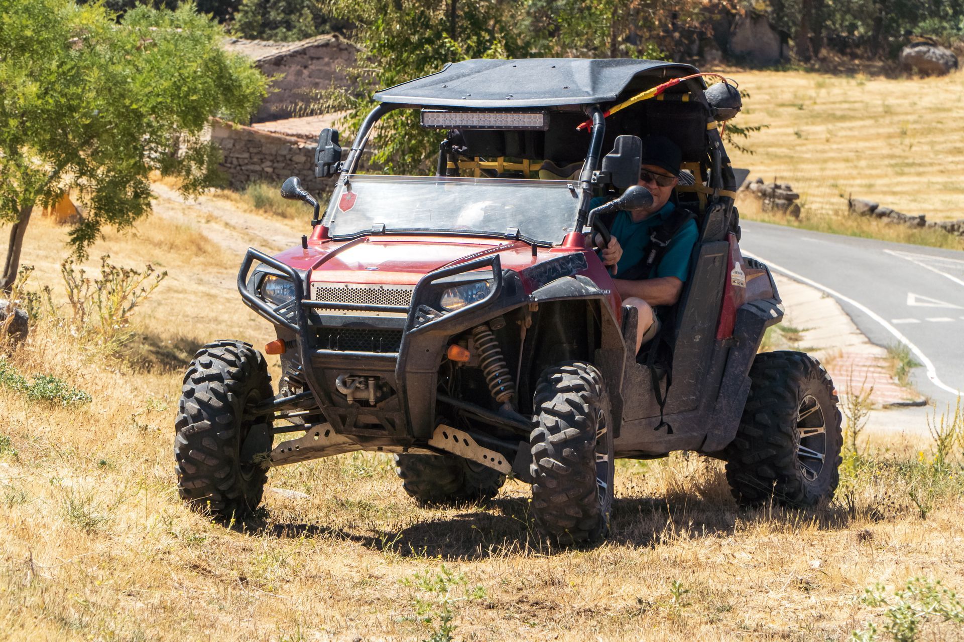 Adventurous man exploring the countryside in a 4x4 UTV buggy quad. Adventurous man exploring the countryside in a 4x4 UTV buggy quad.