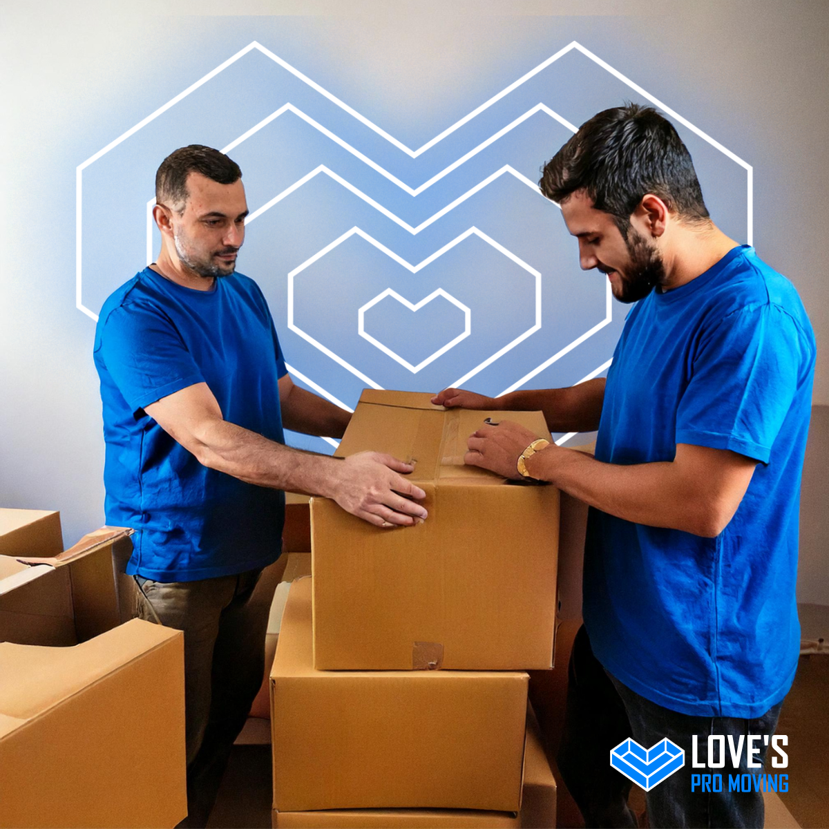 Two men in blue shirts lift a cardboard box. Boxes are stacked; a neon heart shape is on the wall.