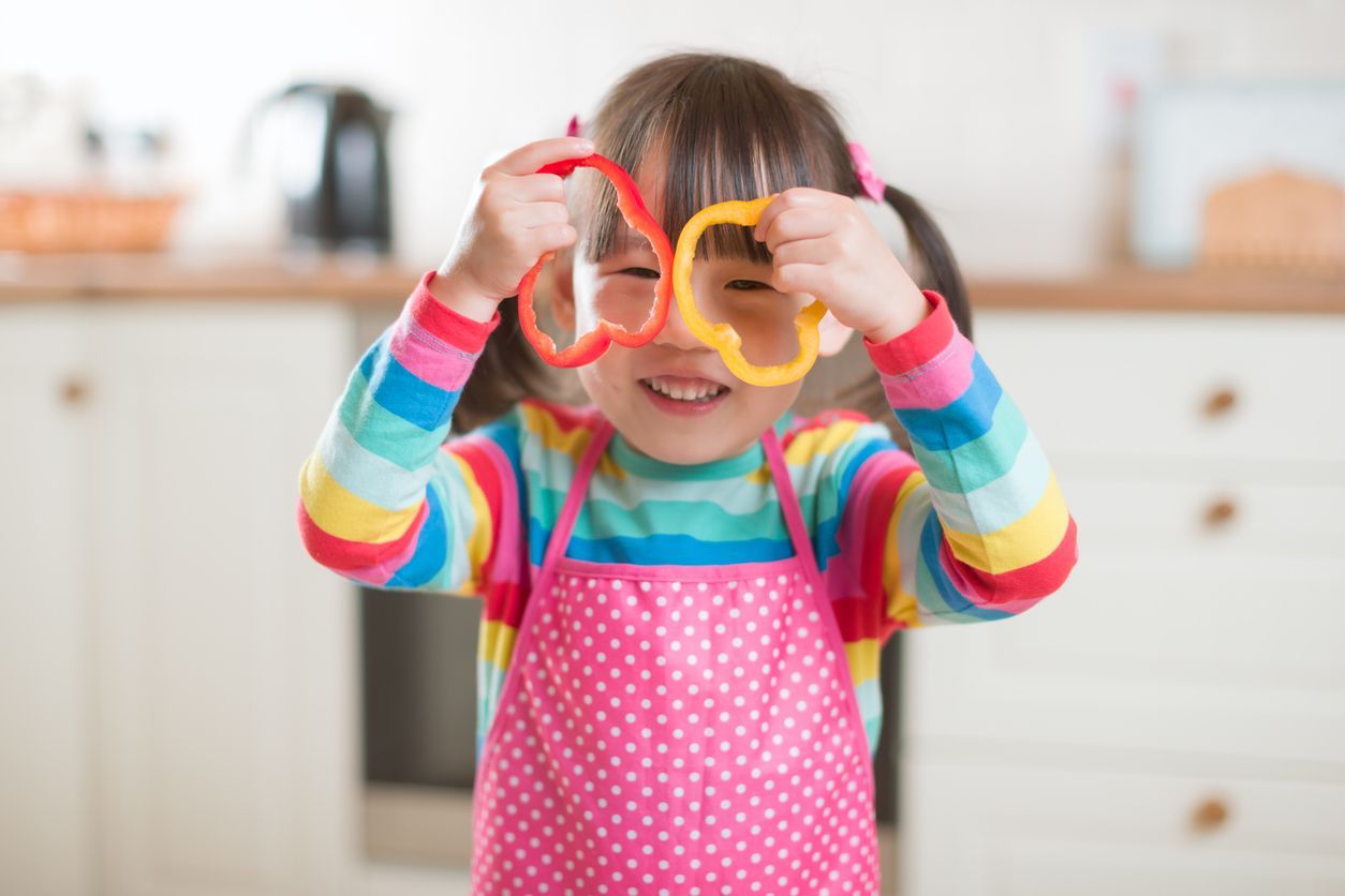 Girl Looking Through Pepper Rings