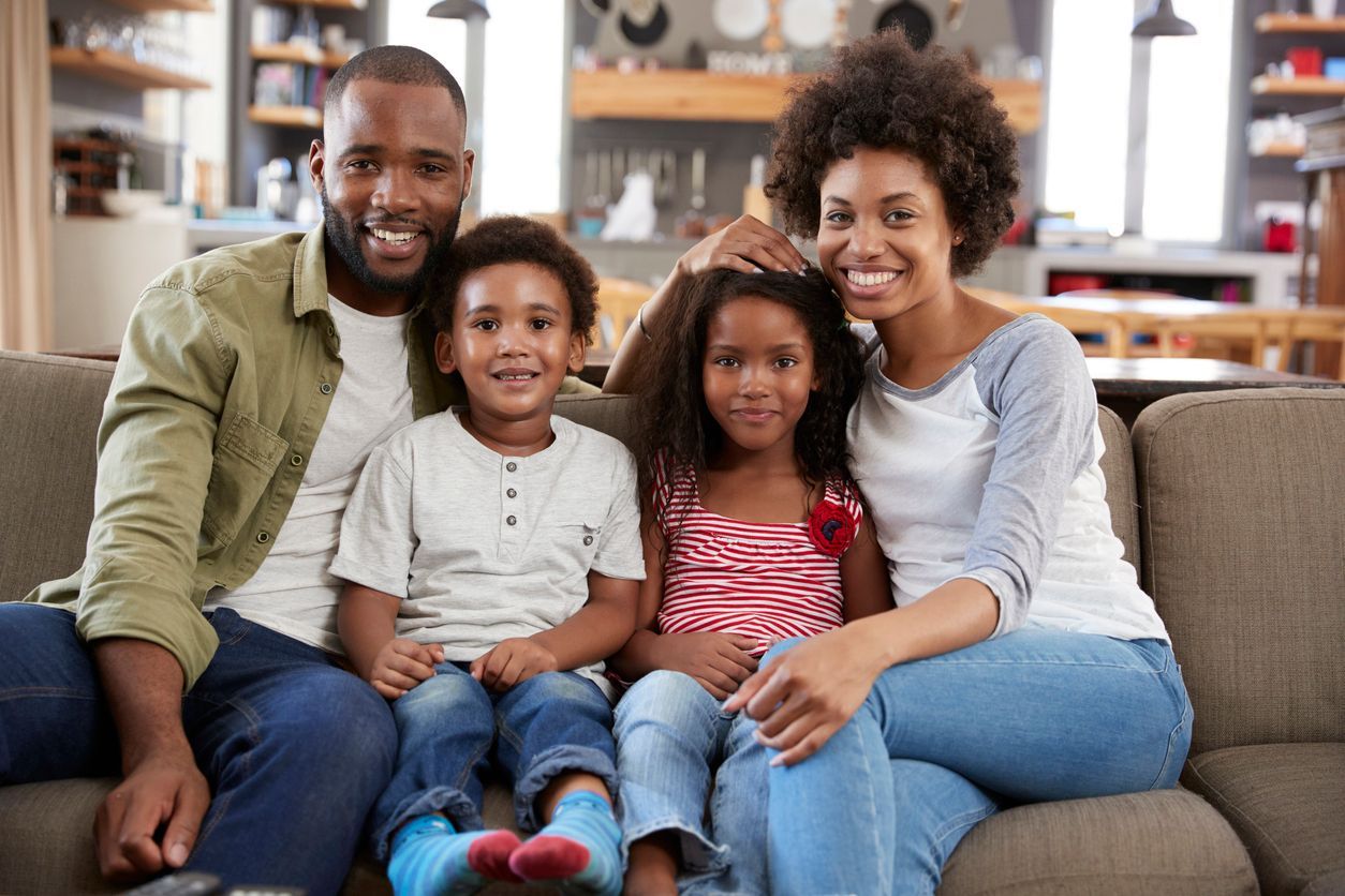 Family sitting on a sofa