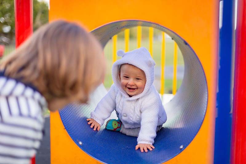 a baby taking slide