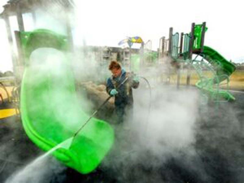 Pressure washing a slide