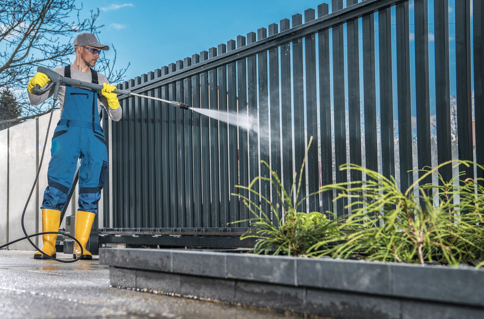 Pressure washing fence