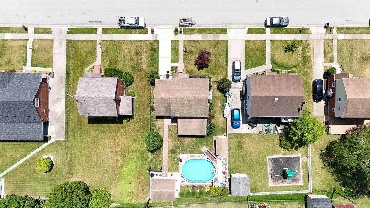 Drone photo looking down on houses and roofs in a Baltimore-area neighborhood