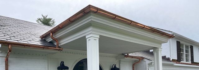 Copper gutter on the front porch roof of a Baltimore-area home