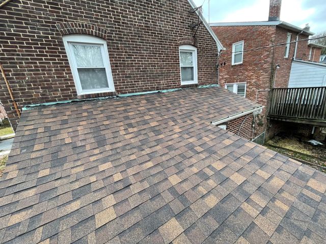 Asphalt shingle roof on a brick home