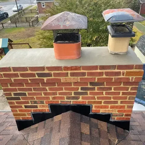 The same chimney after the rebuild, with a new crown and flashing