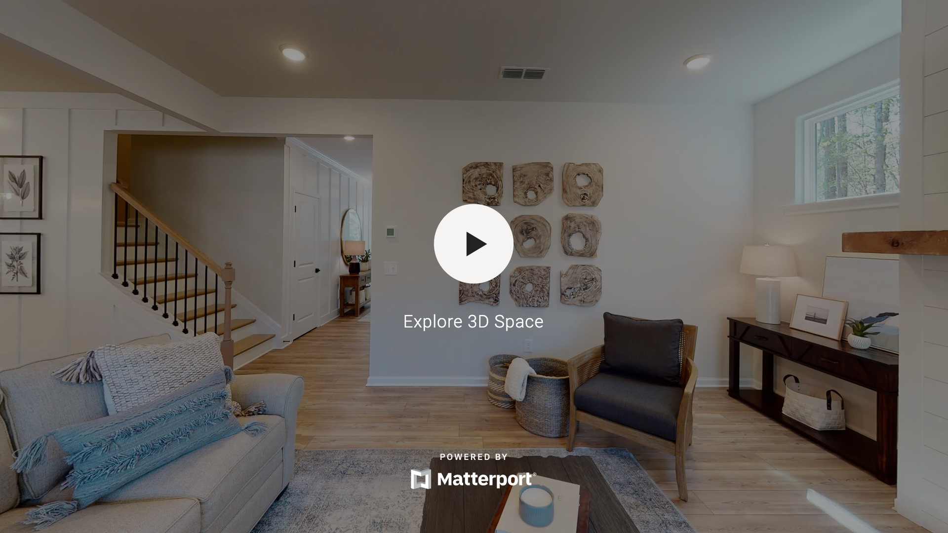 A room with a lot of shelves and a green wall.