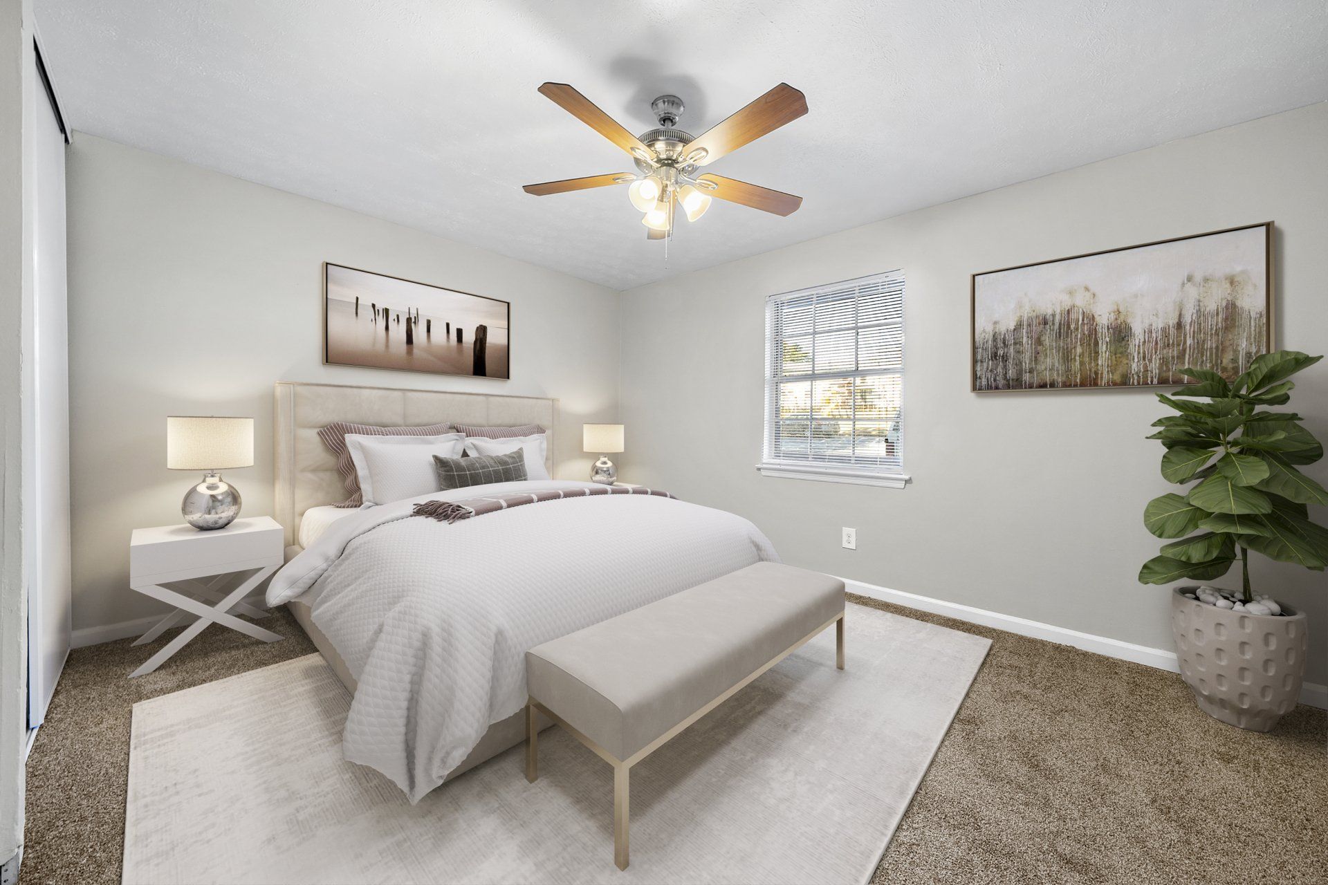 A bedroom with a bed and a ceiling fan