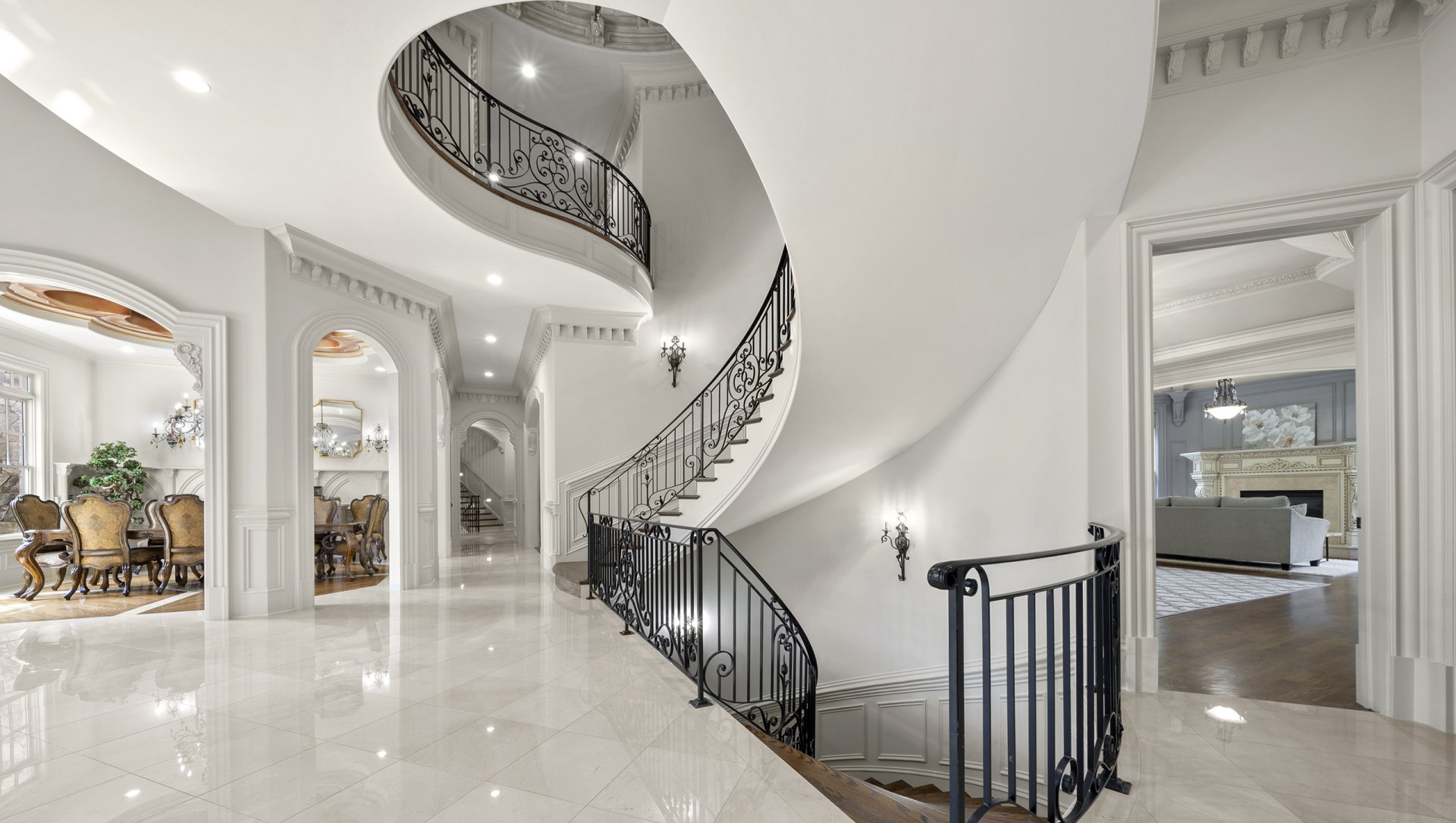 There is a spiral staircase in the middle of the hallway.