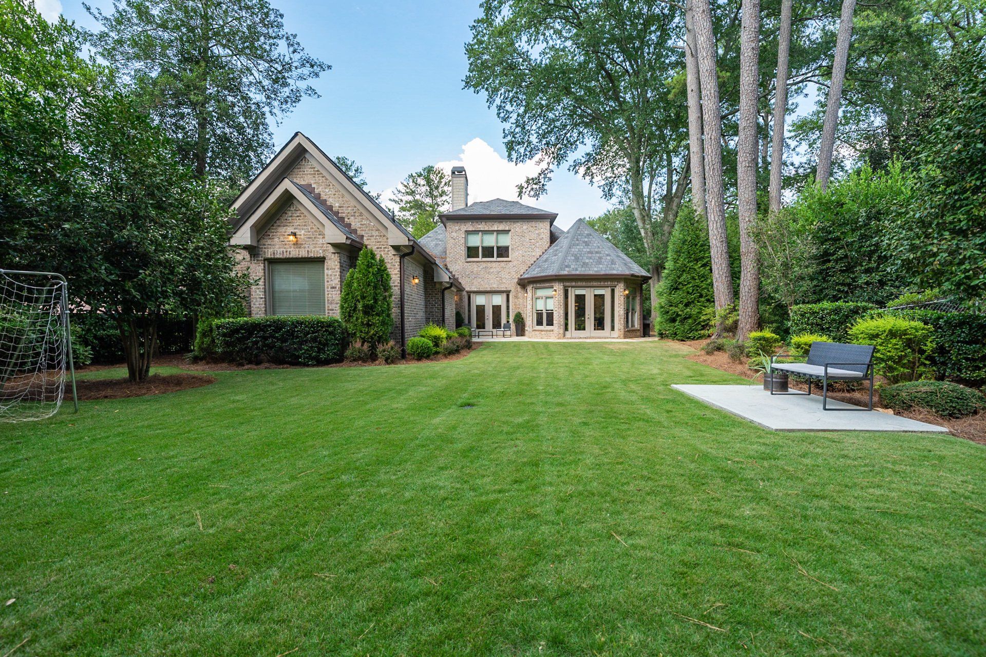 A large house with a large lawn in front of it