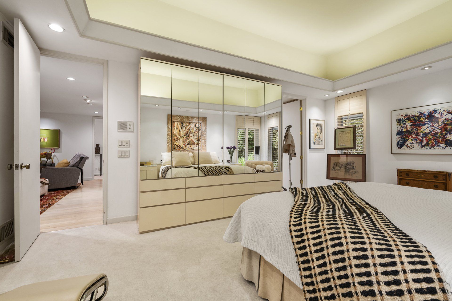 A bedroom with a bed and a couch in it