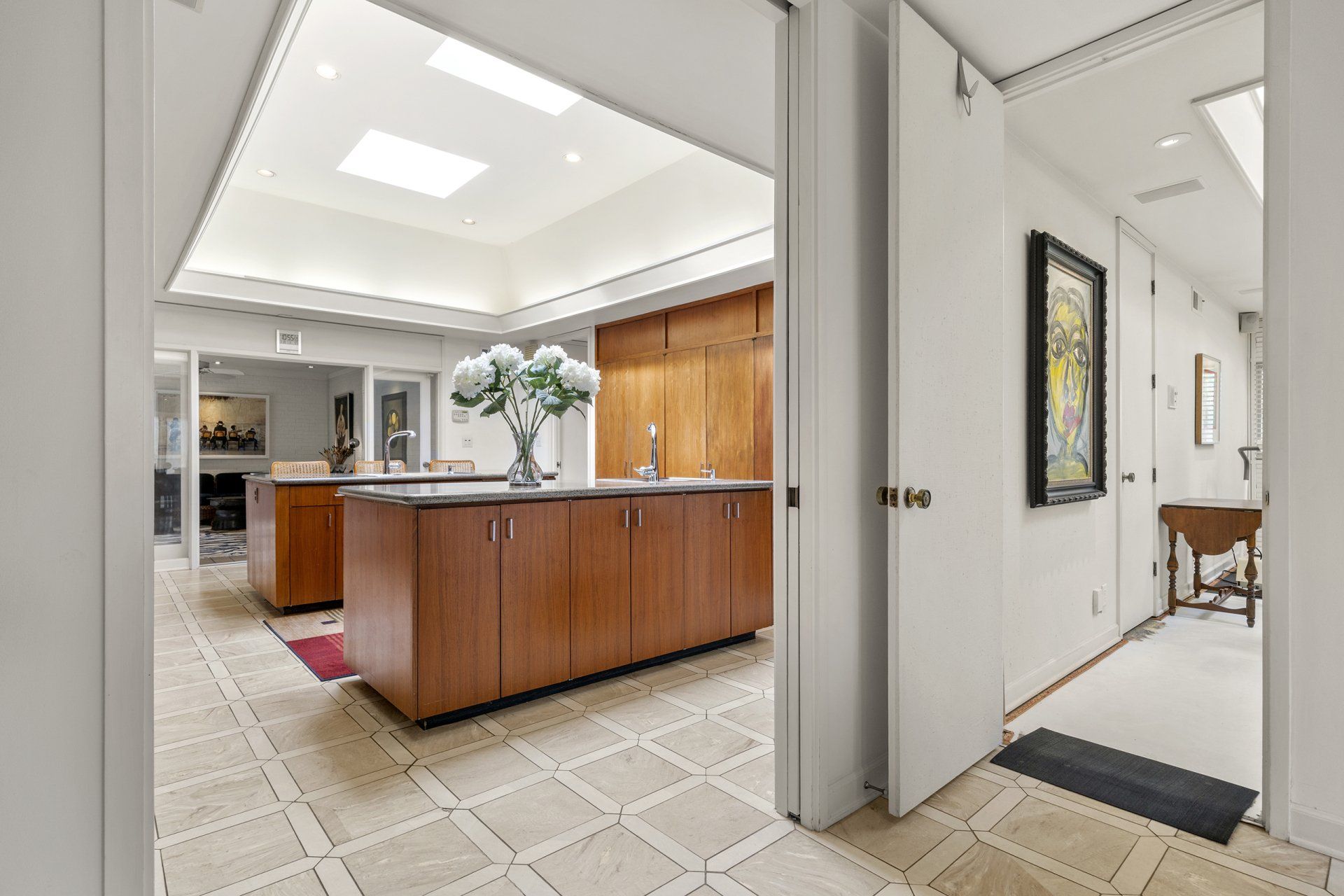 A kitchen with a large island in the middle of the room.