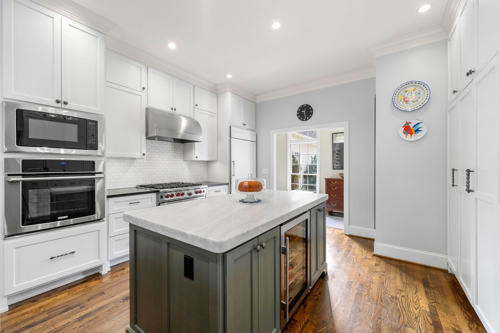 There is a large island in the middle of the kitchen.
