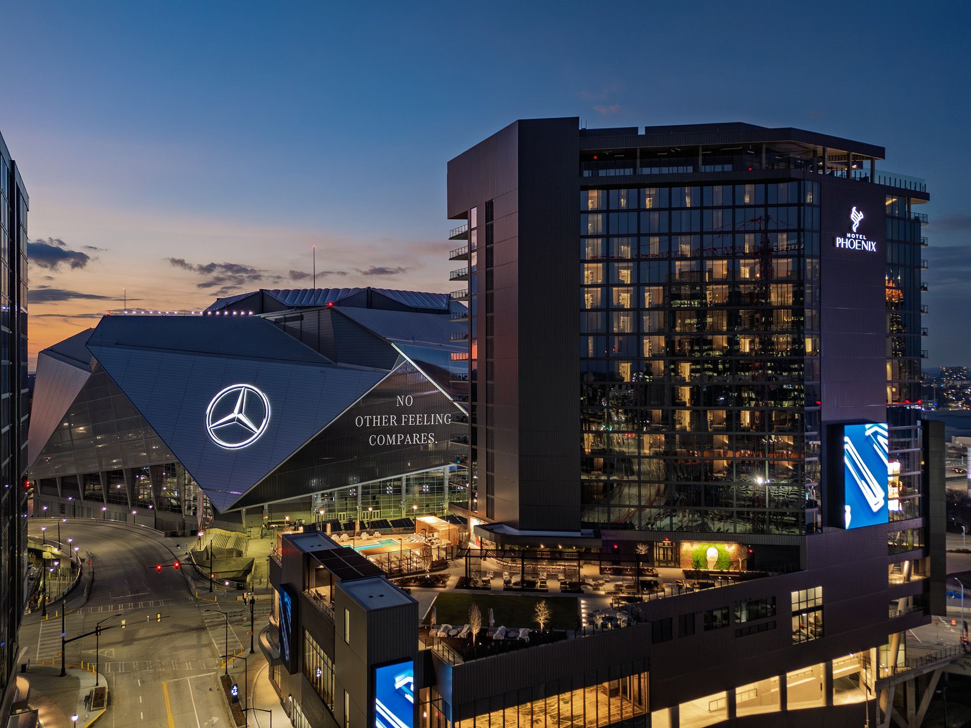 Night view of the Mercedes-Benz Stadium and hotel Phoenix in Centennial Yards in Atlanta, GA