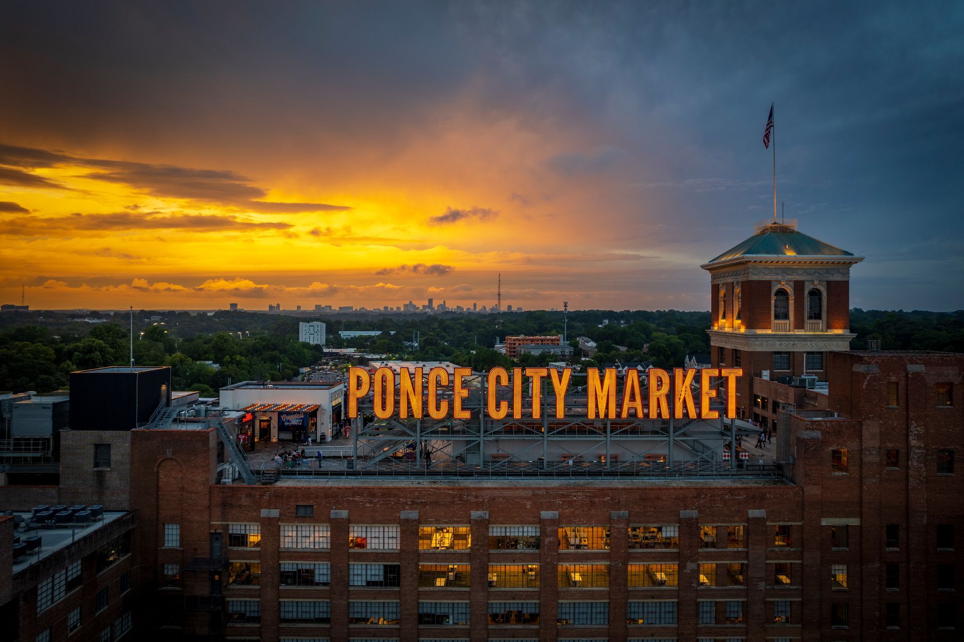 An aerial view of ponce city market at sunset.