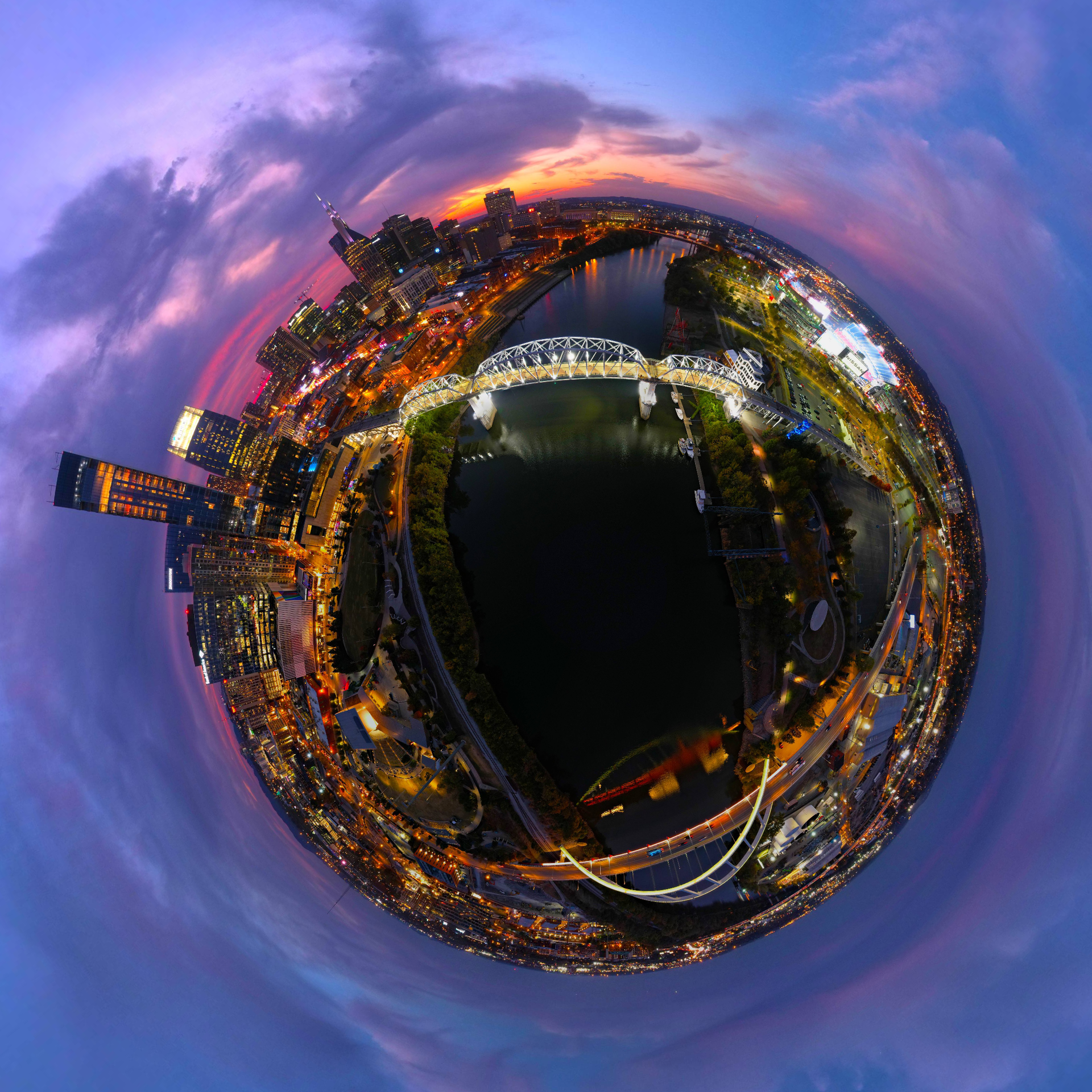 A spherical view of a city with a bridge in the middle