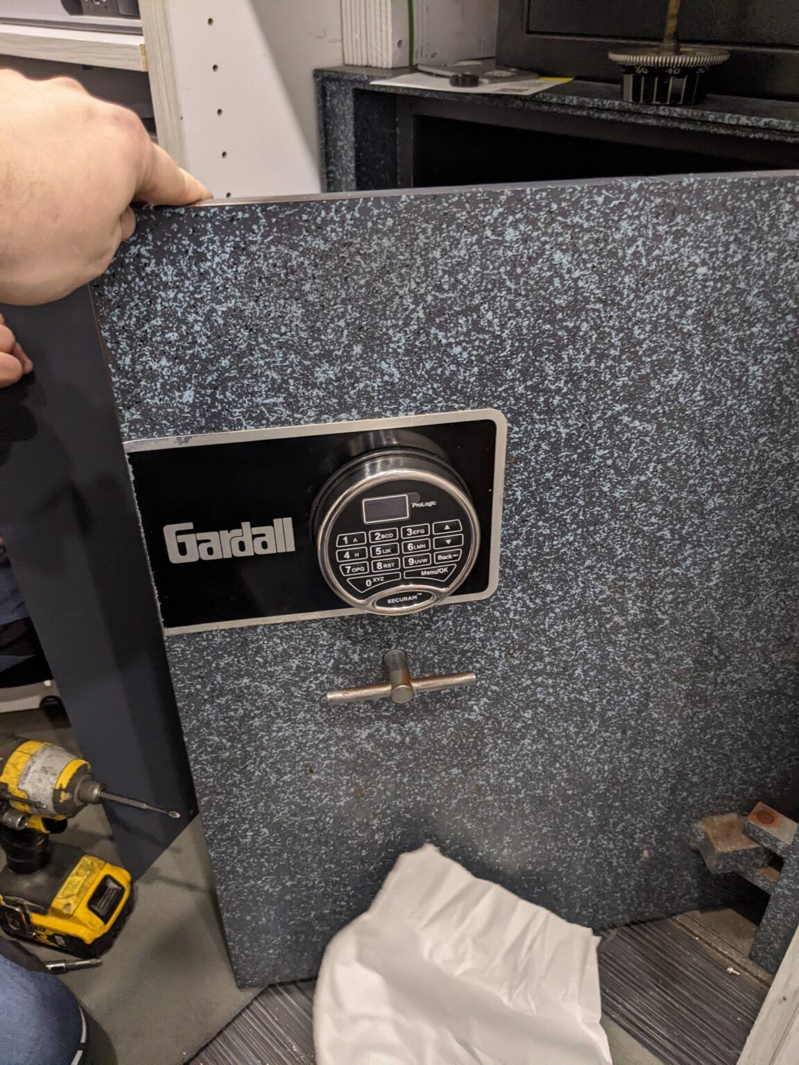 a person is opening a safe