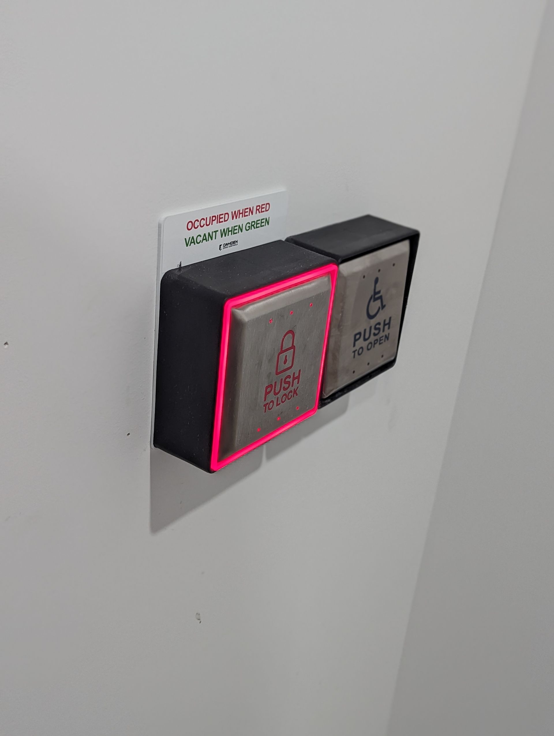 A close up of a light switch on a wall.