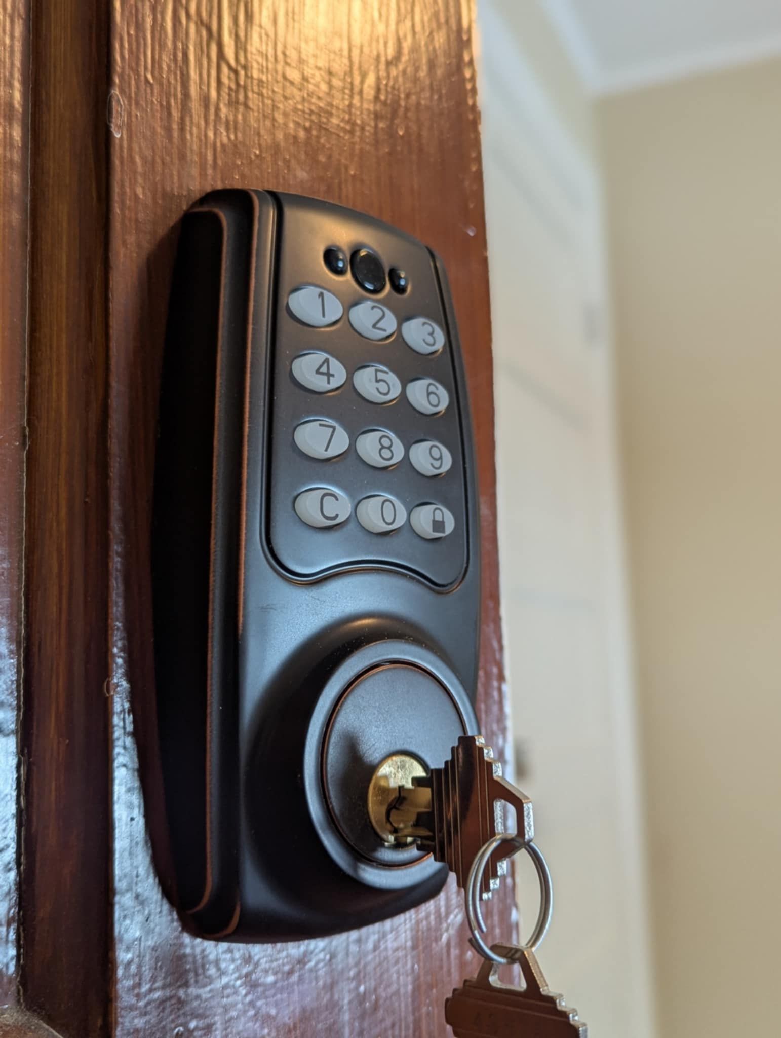 A close up of a door lock with a key in it.